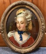 An oval gilt framed and glazed oil on glass reverse portrait of a lady with parrot.