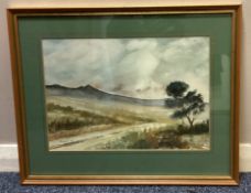 A gilt framed and glazed watercolour depicting a typical Dartmoor Tor scene.
