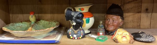 A collection of plaster plaques, miniature guns etc.