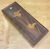A Japanese inlaid caddy with inscription to interior.