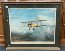 A framed and glazed signed print depicting an old aeroplane.
