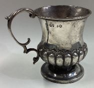 A William IV silver mug of fluted design.