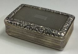 A Georgian silver table snuff box with engine turned decoration.