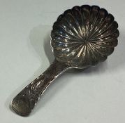 A George III silver caddy spoon with bright-cut decoration to handle.