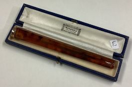 A 9 carat mounted cigarette holder.