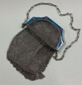 A silver and enamelled purse bearing import marks.