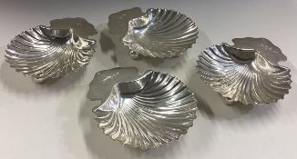 A set of four Victorian silver butter shells.