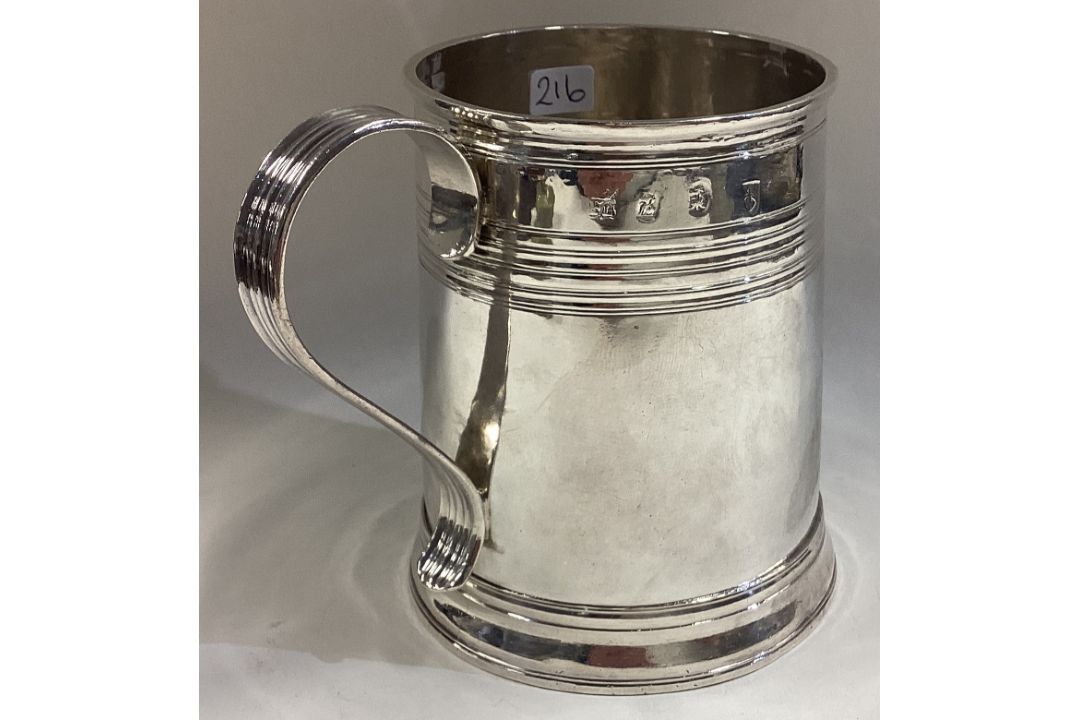 A Queen Anne Britannia Standard silver mug with reeded decoration. - Image 2 of 3