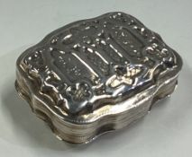 A silver box with lift-off cover and embossed decoration.