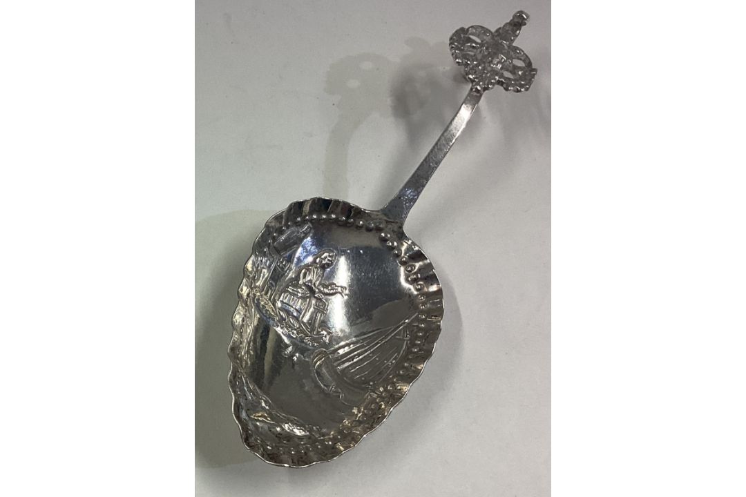 A Dutch silver caddy spoon with chased decoration. - Image 2 of 2