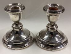 A pair of silver candlesticks.