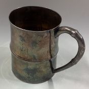 A Japanese silver mug.