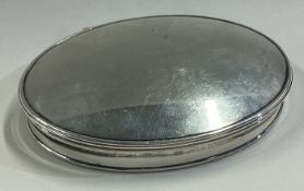 An oval 18th Century silver snuff box with gilt interior.