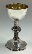 A Victorian silver communion goblet with pierced stem.