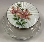 A silver mounted and enamelled glass jar.