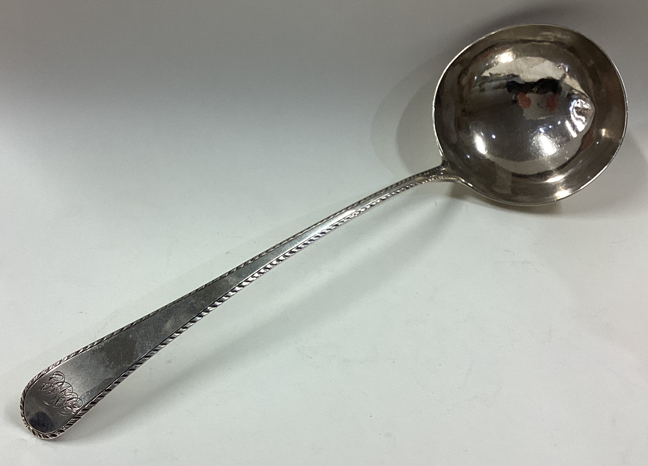 An 18th Century silver bottom marked soup ladle.