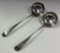 A pair of Georgian silver sauce ladles.