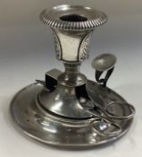 A Continental silver chamberstick with snuffers.