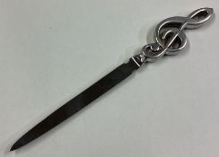OF MUSICAL INTEREST: A rare silver letter opener.