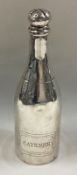 A silver pepper in the form of a champagne bottle.