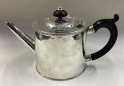 EDINBURGH: An 18th Century Scottish silver teapot with crested decoration.