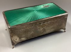 A silver and enamelled cigar box.