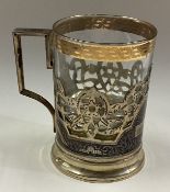 A Russian silver and Niello tea glass holder with glass liner.
