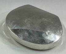 A shaped plain silver snuff box.
