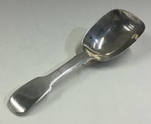 A George III silver caddy scoop.