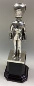 A cast silver figure of a Grenadier Guard.