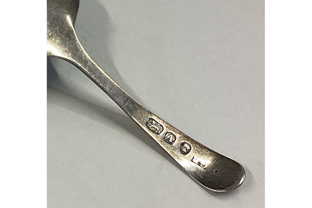 An 18th Century George III silver caddy spoon with bright-cut decoration. - Image 2 of 2