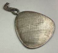 A silver mounted mirror with figural handle.