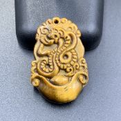 45.10 Cts Natural Carved Tiger Eye Pendant. TDW-00