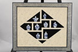 Framed Set of Porcelain Vases