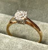 A 9ct Gold Diamond Illusion Cluster Ring With Valuation