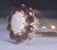 A Stunning 9ct Gold Australian White Crystal Opal and ruby ring – 2.8g - Size M.5.