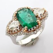 An Exquisite Ring Detailed With Vibrant Emerald, Different Cut Diamonds