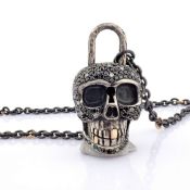 An Exquisite, Convertible Clasp Skull Necklace Embellished With Gold and Diamonds On Silver