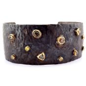 An Exquisite Bangle Detailed With Brilliant Diamonds and Gold On Silver