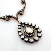 An Exquisite Necklace Detailed With Fancy Cut Diamonds and Gold In Silver