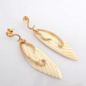 An Exquisite Bone-Carved Wing Earrings Detailed With Brilliant Diamonds and Gold