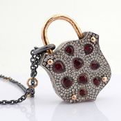 An Exquisite, Convertible Clasp Necklace Embellished With Gold, Colourful Stones, and Diamonds On...