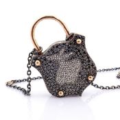 An Exquisite, Convertible Clasp Necklace Embellished With Gold and Diamonds On Silver