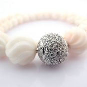 An Exquisite Coral Necklace Detailed With Brilliant Diamonds and Gold