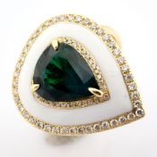 A Luxurious Gold Ring With White Laser Enamel, Adorned With Vibrant Emerald and Brilliant Diamond...