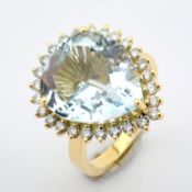 An 18K Yellow Gold Cluster Ring Detailed With 6.57ct Aquamarine and Brilliant Diamonds