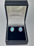 Silver and Synthetic Opal Stud Earring with Cz Halo