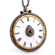 An exquisite necklace made of gold and silver, featuring an antique watch dial adorned with diamond.