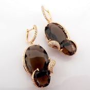 An exquisite earrings detailed with smoky topaz and brilliant diamonds