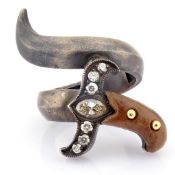 An exquisite sword ring detailed with ebony, brilliant diamonds and gold on silver.